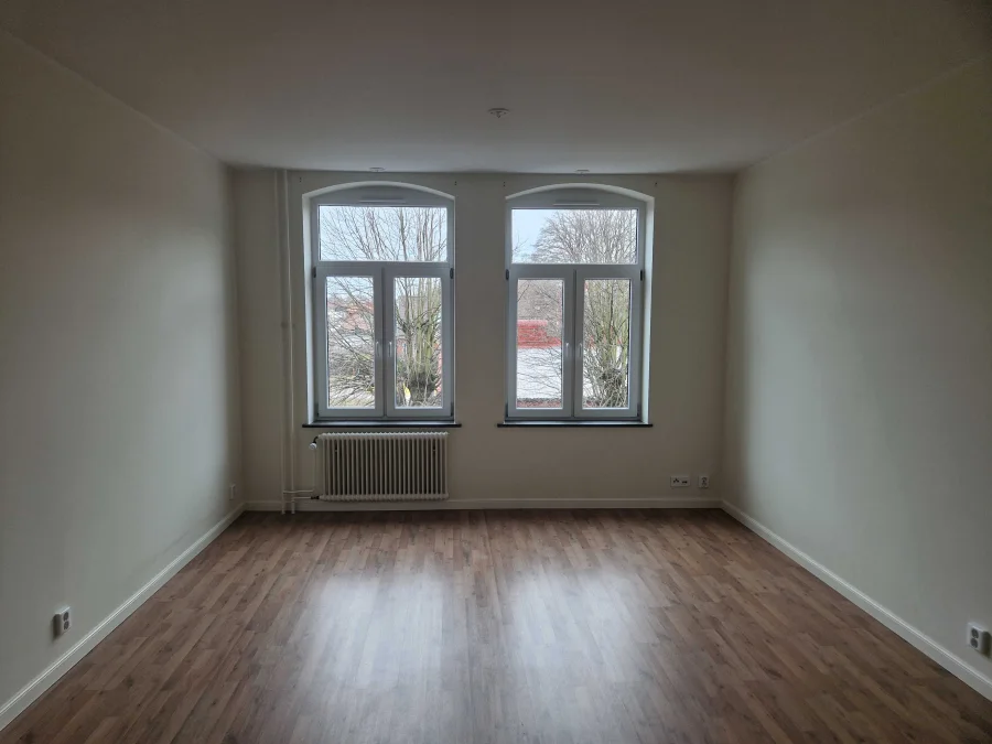 Vardagsrum i modern tvåa på Vattugatan 4 i Halmstad